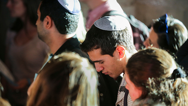 student in yarmulke at prayer service for Tree of Life Synagogue shootings